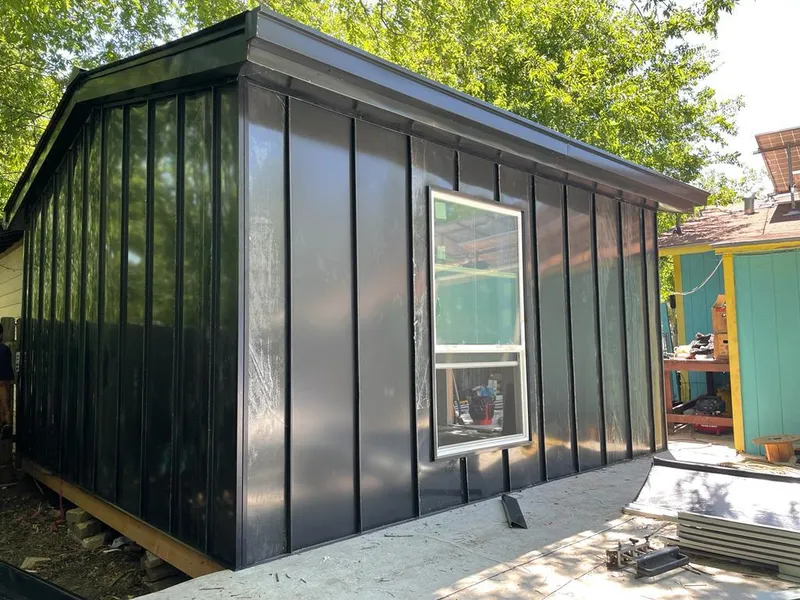 Black standing seam metal wall panels for Roof Inspection in Northborough