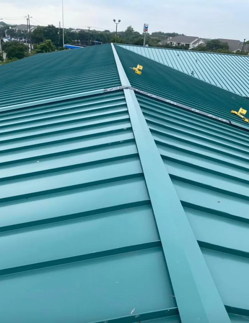Green commercial metal roof ridge and valley for Metal Roof Repair in Northborough